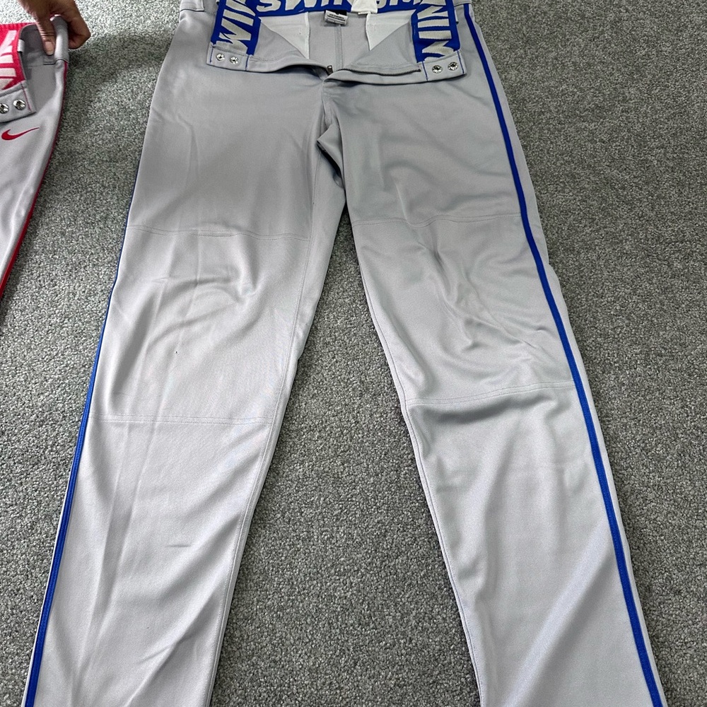 Nike Men’s Gray Baseball Pants (one blue stripe and one red stripe) Size Small